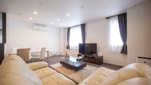 50-inch flat-screen TV with satellite channels, TV, DVD player