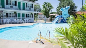 Seasonal outdoor pool, open 8:30 AM to 10:00 PM, pool umbrellas