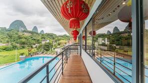 Outdoor pool, open 9:30 AM to 9:00 PM, pool umbrellas, pool loungers