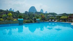 Outdoor pool, open 9:30 AM to 9:00 PM, pool umbrellas, pool loungers