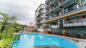 Outdoor pool, open 9:30 AM to 9:00 PM, pool umbrellas, pool loungers