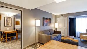 Premium bedding, desk, laptop workspace, blackout drapes