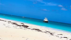 Beach nearby, white sand, sun loungers, beach umbrellas