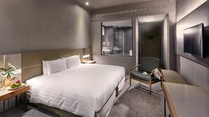 Premium bedding, down comforters, pillowtop beds, minibar