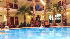 Outdoor pool, pool umbrellas, sun loungers