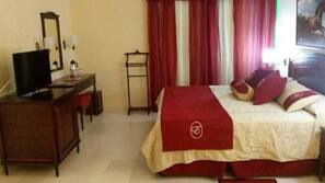 Minibar, desk, linens