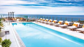 Outdoor pool, open 6 AM to 10:00 PM, sun loungers