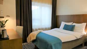 Minibar, desk, blackout curtains, iron/ironing board
