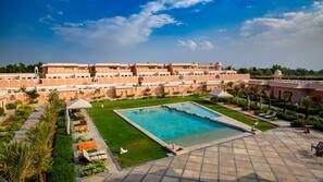 Indoor pool, outdoor pool, free pool cabanas, pool umbrellas