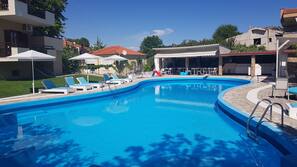 Outdoor pool, pool umbrellas, pool loungers