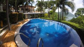 Outdoor pool, open 6 AM to 10 PM, pool umbrellas, sun loungers