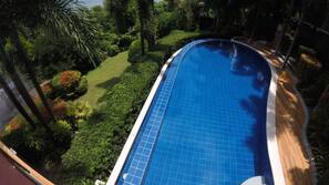 Outdoor pool, open 6 AM to 10 PM, pool umbrellas, sun loungers
