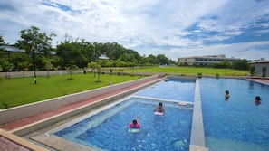 Outdoor pool, a natural pool, open 8:00 AM to 6:00 PM, pool umbrellas