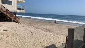 On the beach, sun loungers, beach towels