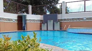 Outdoor pool, open 6 AM to midnight, free cabanas, pool umbrellas