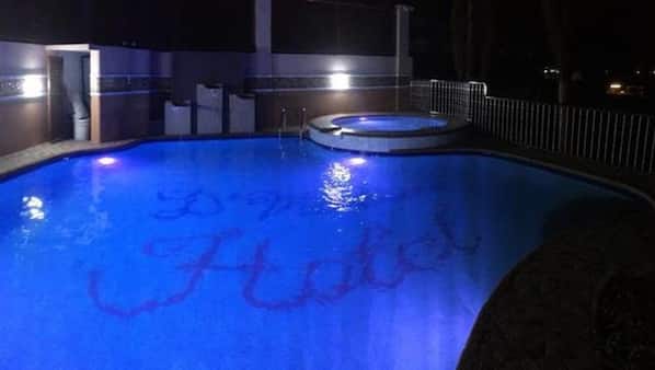 Outdoor pool, open 6 AM to midnight, free cabanas, pool umbrellas