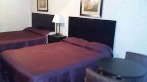 Desk, blackout drapes, iron/ironing board, rollaway beds