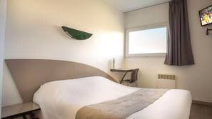 Desk, blackout curtains, free WiFi, linens