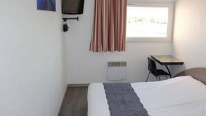 Desk, blackout curtains, free WiFi, linens