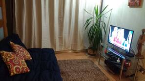 TV de tela plana, DVD player, dock para MP3