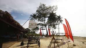 On the beach, sun-loungers, beach umbrellas, snorkelling