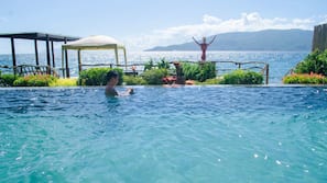 2 outdoor pools, an infinity pool, open 6 AM to 10 PM, pool umbrellas