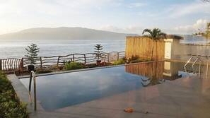 2 outdoor pools, an infinity pool, open 6 AM to 10 PM, pool umbrellas