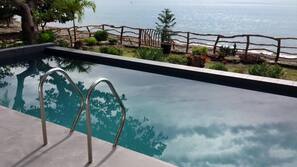 2 outdoor pools, an infinity pool, open 6 AM to 10 PM, pool umbrellas
