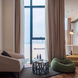 Luxury Double Room with River View | Living room | TV