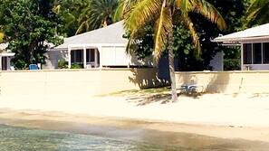 On the beach, white sand, sun-loungers, beach umbrellas