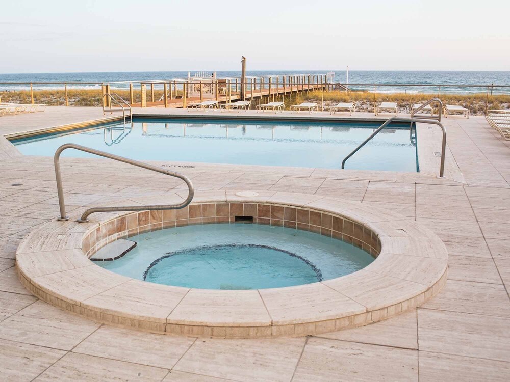 Beachfront Condo with Resort Style Amenities, Private Balcony Overlooking Sand