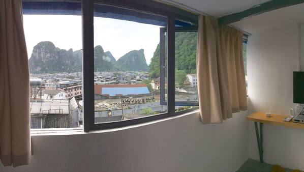 Desk, blackout curtains, free WiFi, linens