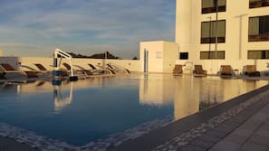 Outdoor pool, open 7:00 AM to 10:00 PM, pool loungers