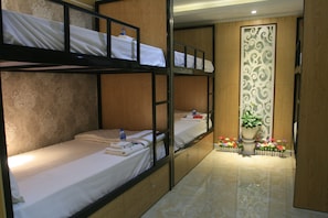 Bed in 8-Beds Dormitory | Living room | Flat-screen TV
