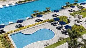 Outdoor pool, open 7:00 AM to 7:00 PM, free pool cabanas, pool umbrellas