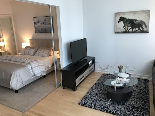 Check Expedia for Availability of High Rise 2BR next to Air Canada Ct
