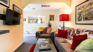 Flat-screen TV, DVD player, video library, stereo