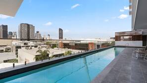 Outdoor pool, open 7 AM to 10 PM, free cabanas, pool umbrellas