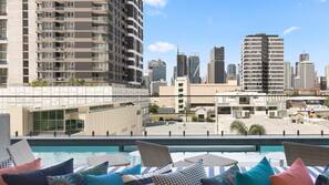 Outdoor pool, open 7 AM to 10 PM, free cabanas, pool umbrellas