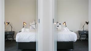 Premium bedding, blackout curtains, soundproofing, iron/ironing board