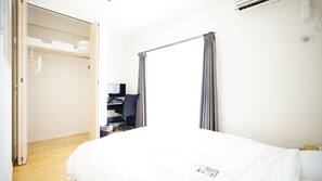 Desk, blackout curtains, free WiFi, linens
