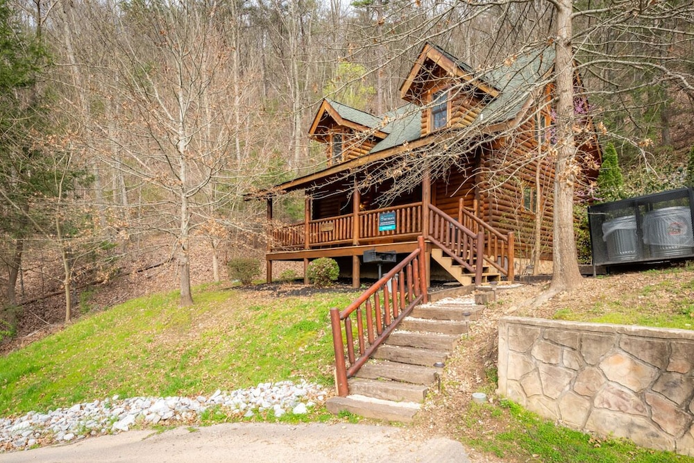 Inviting cabin with pool table, hot tub, fireplace, and pool access