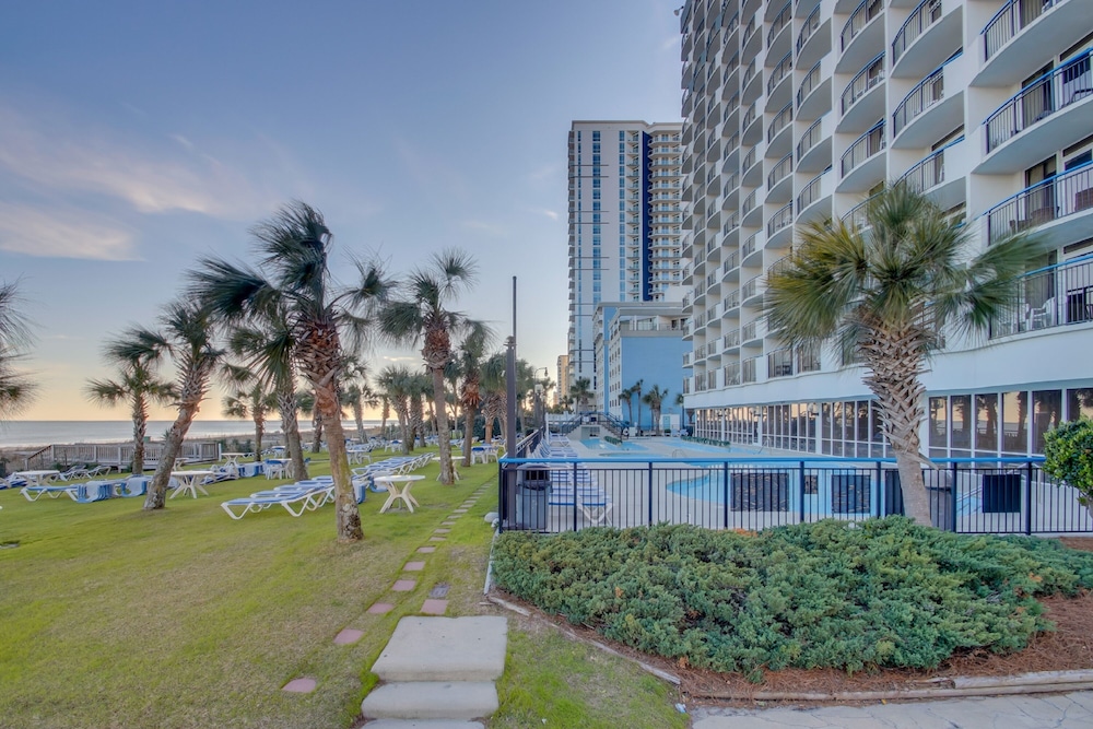 Illustration of Sustainable Beachfront Condos With Private Oceanfront Balconies And Green Spaces