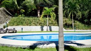 Outdoor pool, open 6:00 AM to 10:00 PM, sun loungers