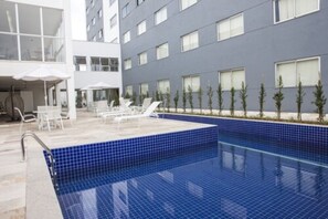 Outdoor pool, pool umbrellas, sun loungers
