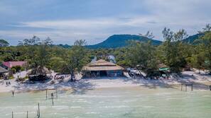 On the beach, sun-loungers, beach umbrellas, beach towels