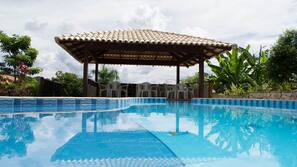 Outdoor pool, a waterfall pool, sun loungers