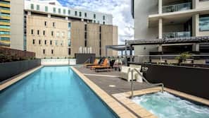 Outdoor pool, open 7 AM to 10 PM, pool loungers