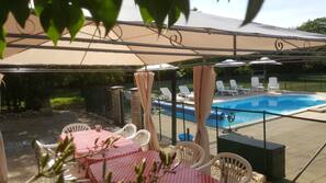 2 outdoor pools, pool umbrellas, pool loungers