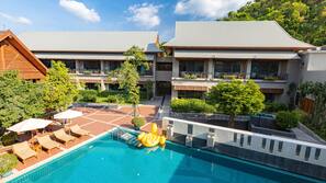 Outdoor pool, open 8 AM to 7 PM, pool umbrellas